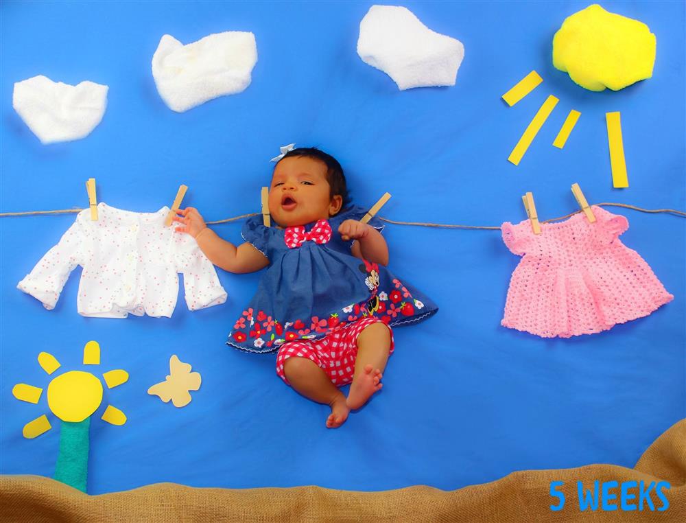 Making a playful laundry line scene with baby clothes.